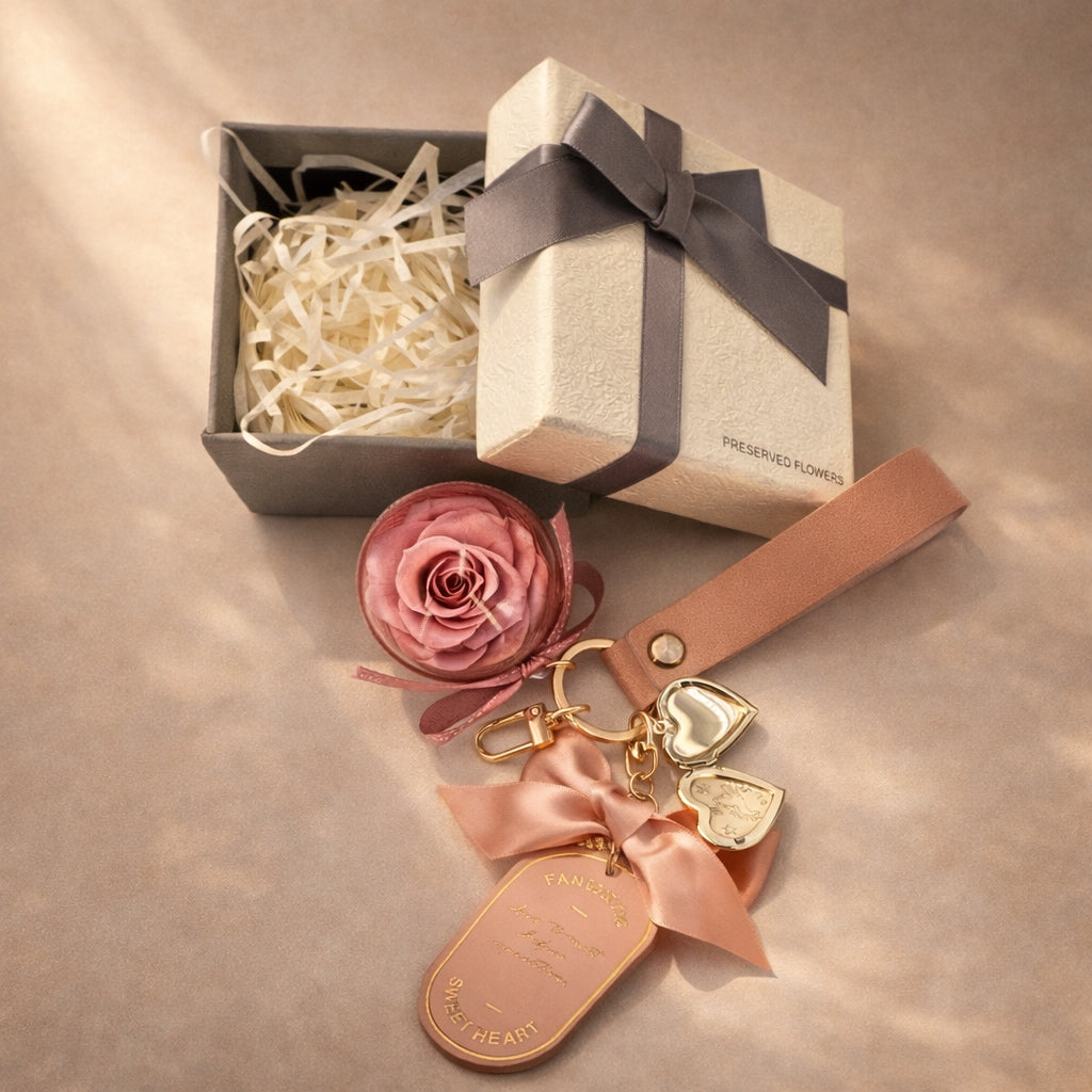 Keychain with heart-shaped charms and pink preserved  rose next to a gift box, ready to gift, Australia