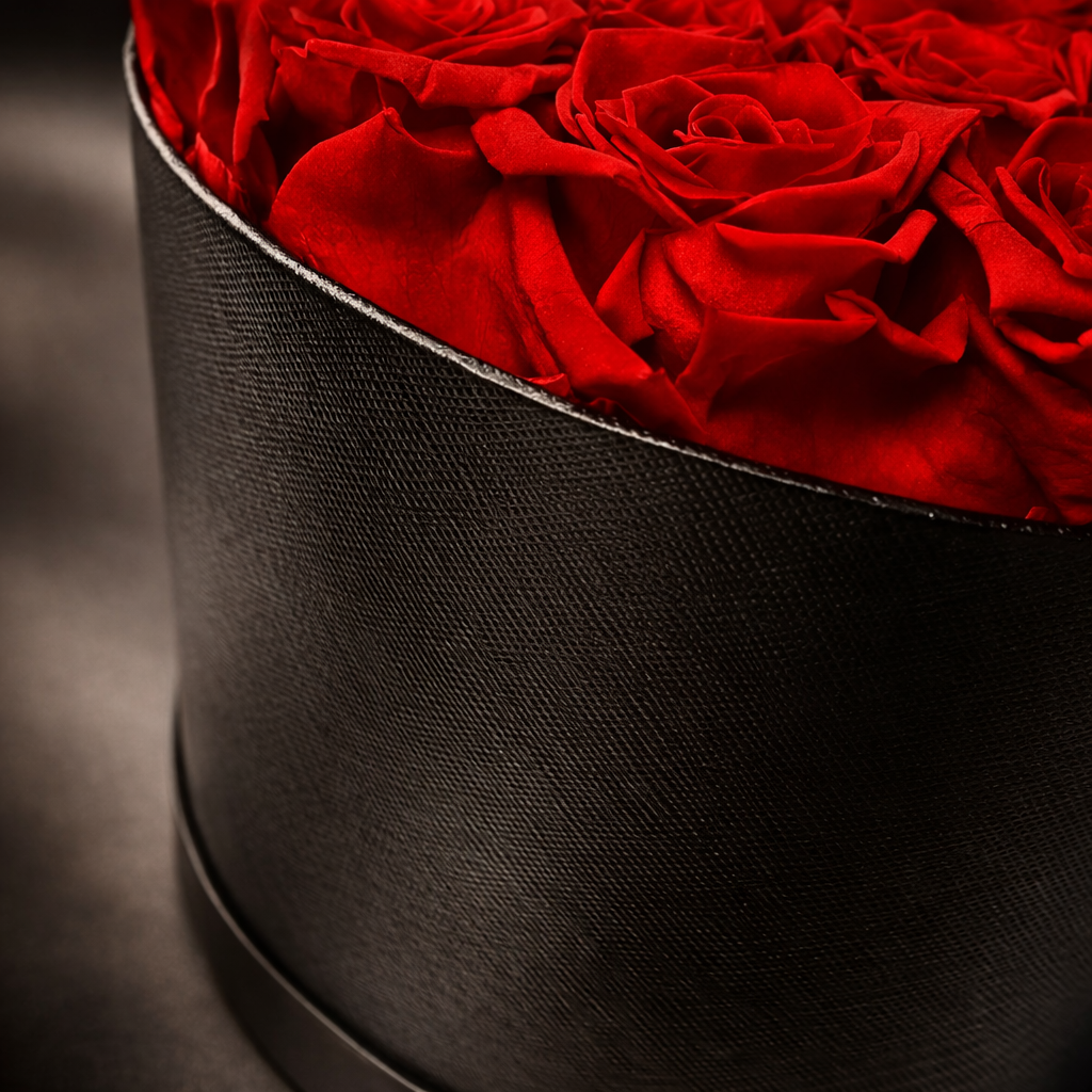 real preserved red pink close up, natural petal texture, black leather textured box