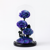 Three purple roses in a glass dome on a white background