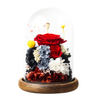 Colorful preserved flowers under a glass dome on a wooden base with a white background
