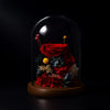 Red rose and other preserved flowers under a glass dome on a black background