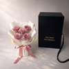 mother's day gift preserved roses Bouquet of pink roses with a luxury black box labeled 'For now. For always.' on a light background